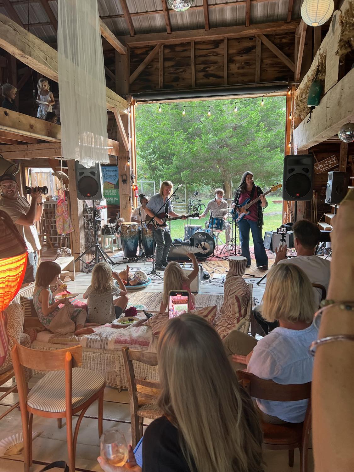 The band playing to a full barn of adults and children