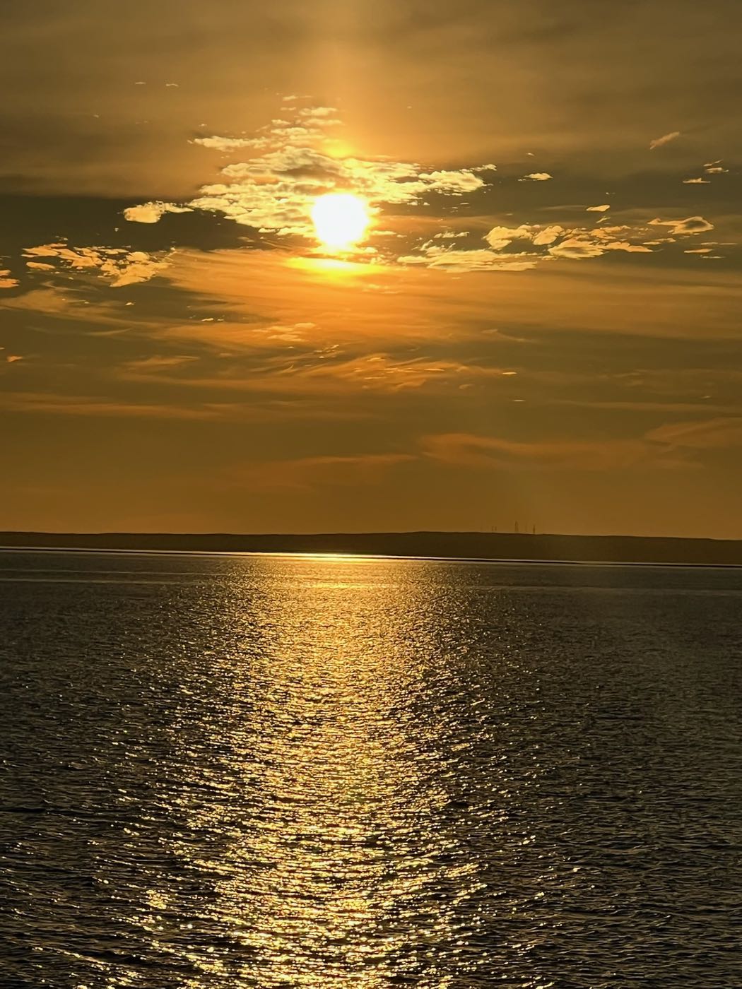 The sun setting over the water